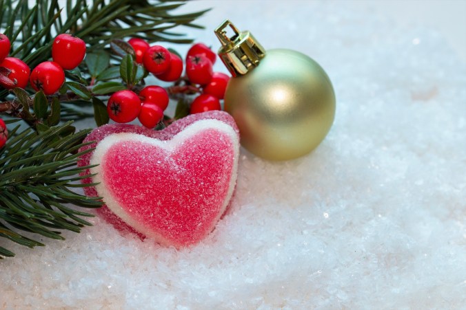 A picture of Christmas decorations that includes a pink heart.