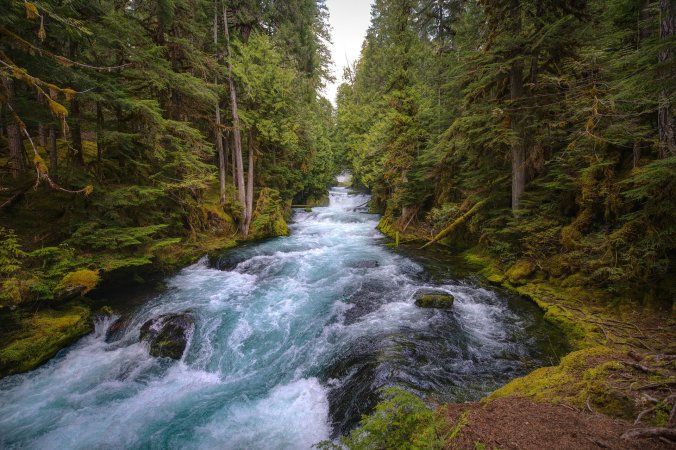 A visual of turbulent waters in a swirling river to capture the theme of God's protection in danger.